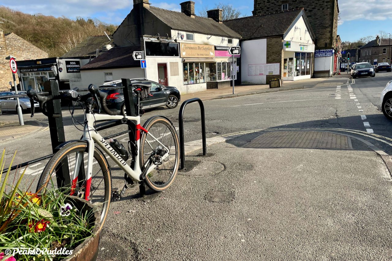 New cycle stands beside Canal Street, Whaley Bridge — preferable to fumbling with awkward railings, but not perfect.