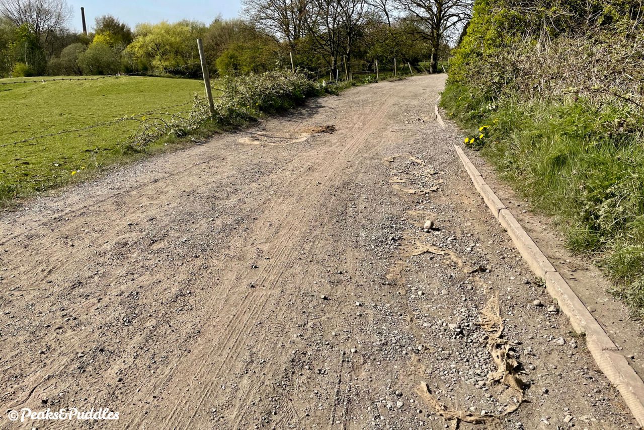 The Dark Lane section of the Alan Newton Way has become heavily damaged just a few years after resurfacing — and this is when it's dry.