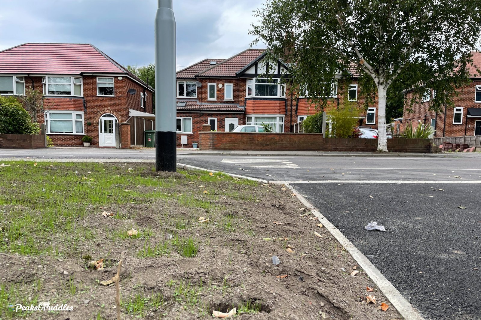 A side view of the "BMX Track" on the A6 to Bramhall Park scheme, showing the astonishing rise and fall of the path passing each driveway.