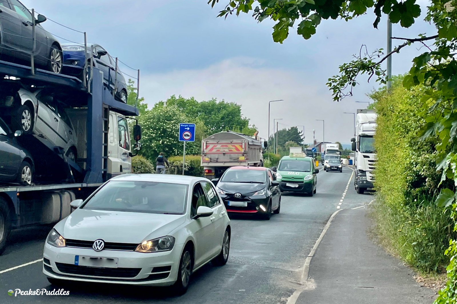 A view of the A6 from Middlewood Way towards the A555, showing constant heavy traffic with no space for cycling.